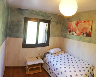 Cama o camas de una habitación en vivienda isabel