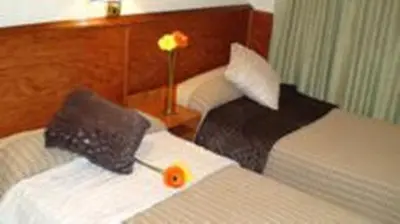 Cama o camas de una habitación en Hostal El Carmen