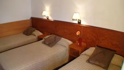 Cama o camas de una habitación en Hostal El Carmen