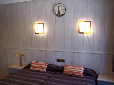 Cama o camas de una habitación en Hostal El Carmen