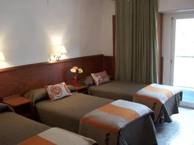 Cama o camas de una habitación en Hostal El Carmen