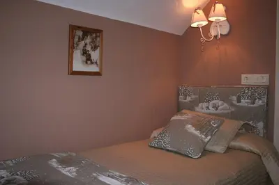Cama o camas de una habitación en Hotel Boutique Balaitus