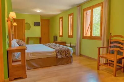 Cama o camas de una habitación en Hotel Sabocos