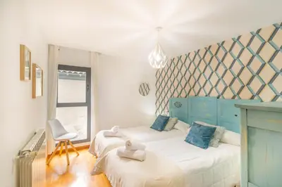 Cama o camas de una habitación en Casa Ferran, amplias habitaciones y apartamentos de montaña