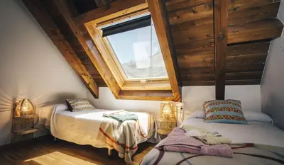 Cama o camas de una habitación en Casa Ferran, amplias habitaciones y apartamentos de montaña