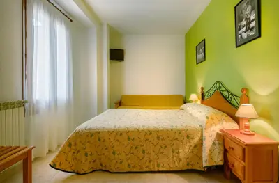 Cama o camas de una habitación en Hostal Kimboa