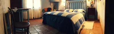 Cama o camas de una habitación en Hotel La Posada de Lalola