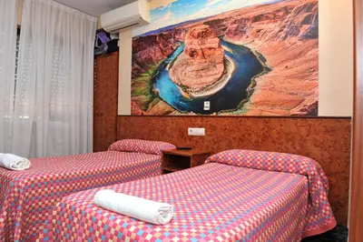 Cama o camas de una habitación en Hostal Venecia