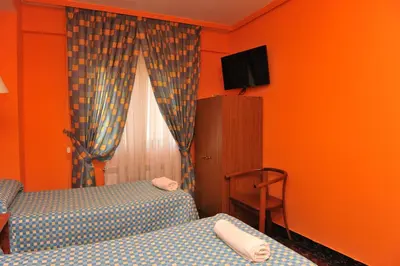 Cama o camas de una habitación en Hostal Venecia