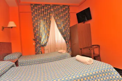 Cama o camas de una habitación en Hostal Venecia