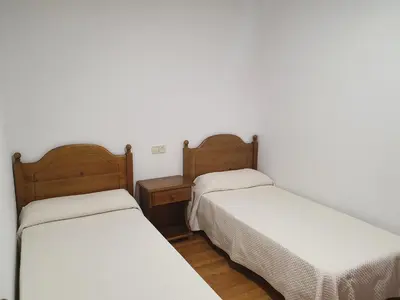 Cama o camas de una habitación en Hostal Apolo XI