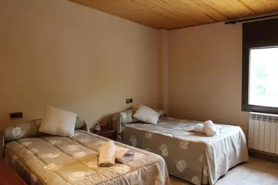 Cama o camas de una habitación en Apartamentos Turísticos Can Rocamora