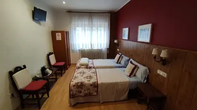 Cama o camas de una habitación en Hostal Escartín