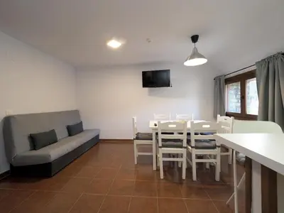 Una televisión o centro de entretenimiento en Centro de Vacaciones Morillo de Tou - Ainsa