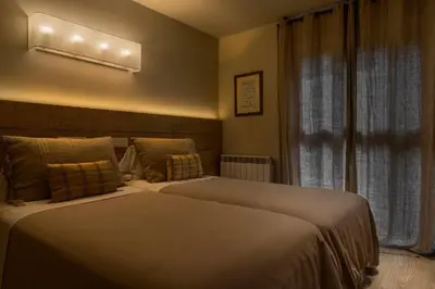 Cama o camas de una habitación en MONTELIA Ático El Ciervo de Panticosa