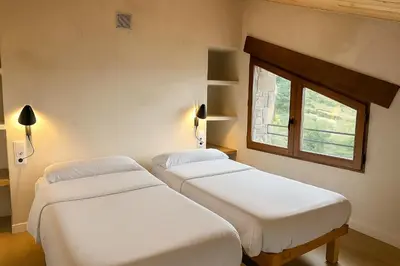 Cama o camas de una habitación en Poble Rural Puig Arnau - Pubilló