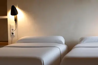 Cama o camas de una habitación en Poble Rural Puig Arnau - Pubilló
