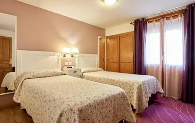 Cama o camas de una habitación en Hostal Vidaller