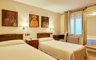 Cama o camas de una habitación en Hostal Vidaller
