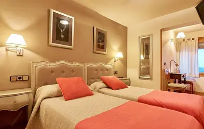 Cama o camas de una habitación en Hostal Vidaller