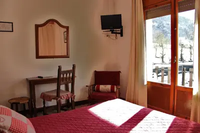 Cama o camas de una habitación en Hotel Garona