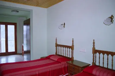 Cama o camas de una habitación en Hostal Fondevila