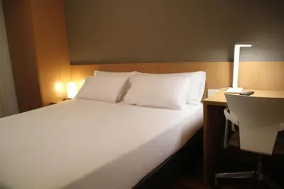 Cama o camas de una habitación en Hostal Abodi