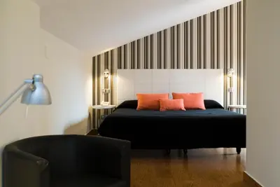 Cama o camas de una habitación en Posada del Almudí