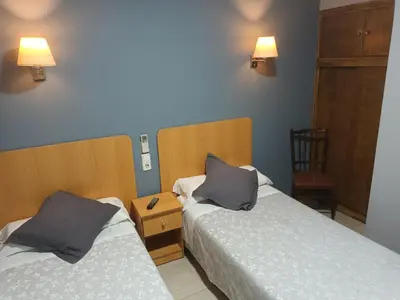 Cama o camas de una habitación en Hostal Can Jaume