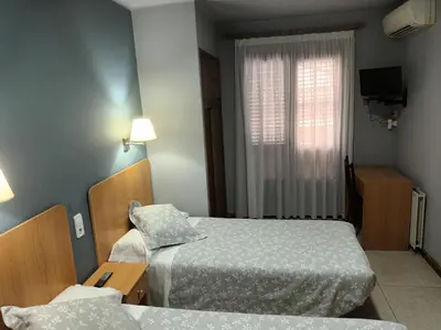Cama o camas de una habitación en Hostal Can Jaume