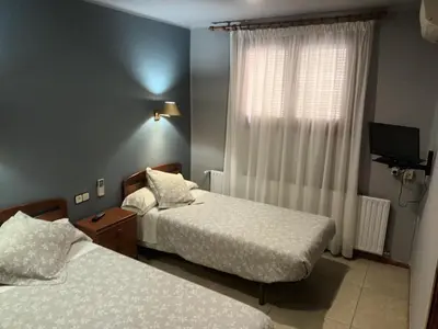 Cama o camas de una habitación en Hostal Can Jaume