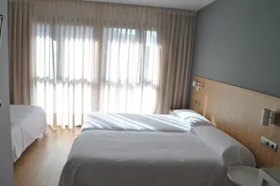 Cama o camas de una habitación en Hostal Universitat