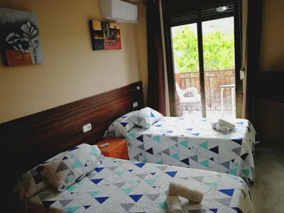 Cama o camas de una habitación en Hostal Escarla