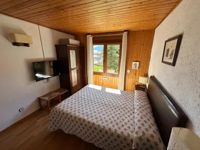 Cama o camas de una habitación en Hotel Els Puis