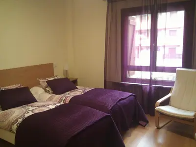 Cama o camas de una habitación en Apartamentos Argualas