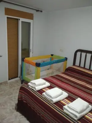 Cama o camas de una habitación en Antigua Casa Pepo y Casa Marieta