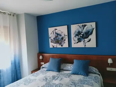 Cama o camas de una habitación en Hostal Casa Barranco