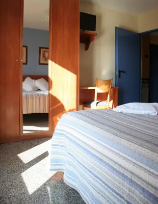 Cama o camas de una habitación en Hostal Casa Barranco