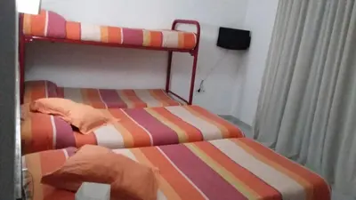 Cama o camas de una habitación en Hostal Les Collades