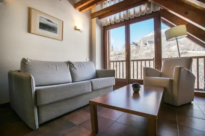 Zona de estar de Apartamentos SNÖ Mont Romies Unhola