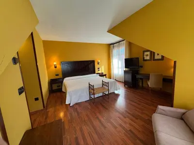 Cama o camas de una habitación en Hotel Cotiella