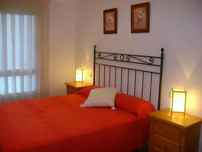 Cama o camas de una habitación en Apartamentos Pirineos Ordesa II