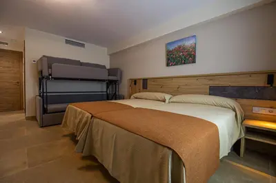 Cama o camas de una habitación en Hostal Las Grullas