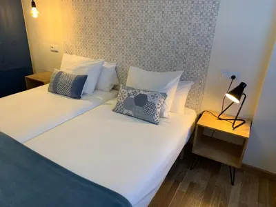 Cama o camas de una habitación en Apartamentos Best Ainsa