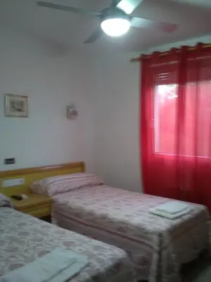 Cama o camas de una habitación en Hostal Restaurante el Cazador
