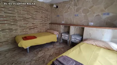 Cama o camas de una habitación en Casa rural L´Amparo -3 espigas- Categoría superior-15 personas
