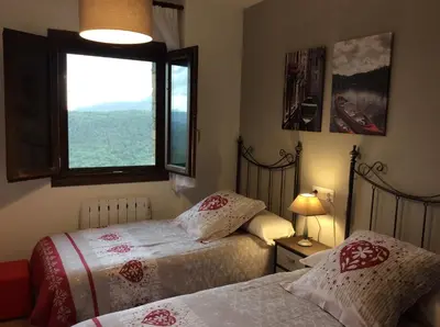 Cama o camas de una habitación en Balcón de Garbisón I