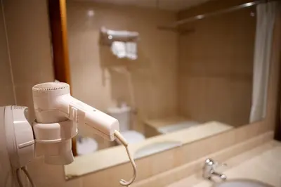 Un baño de Hotel Jardí Apartaments