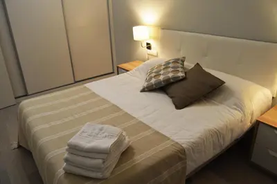 Cama o camas de una habitación en Apartamenticos Plaza del Pilar I