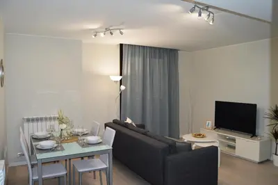 Una televisión o centro de entretenimiento en Apartamenticos Plaza del Pilar I